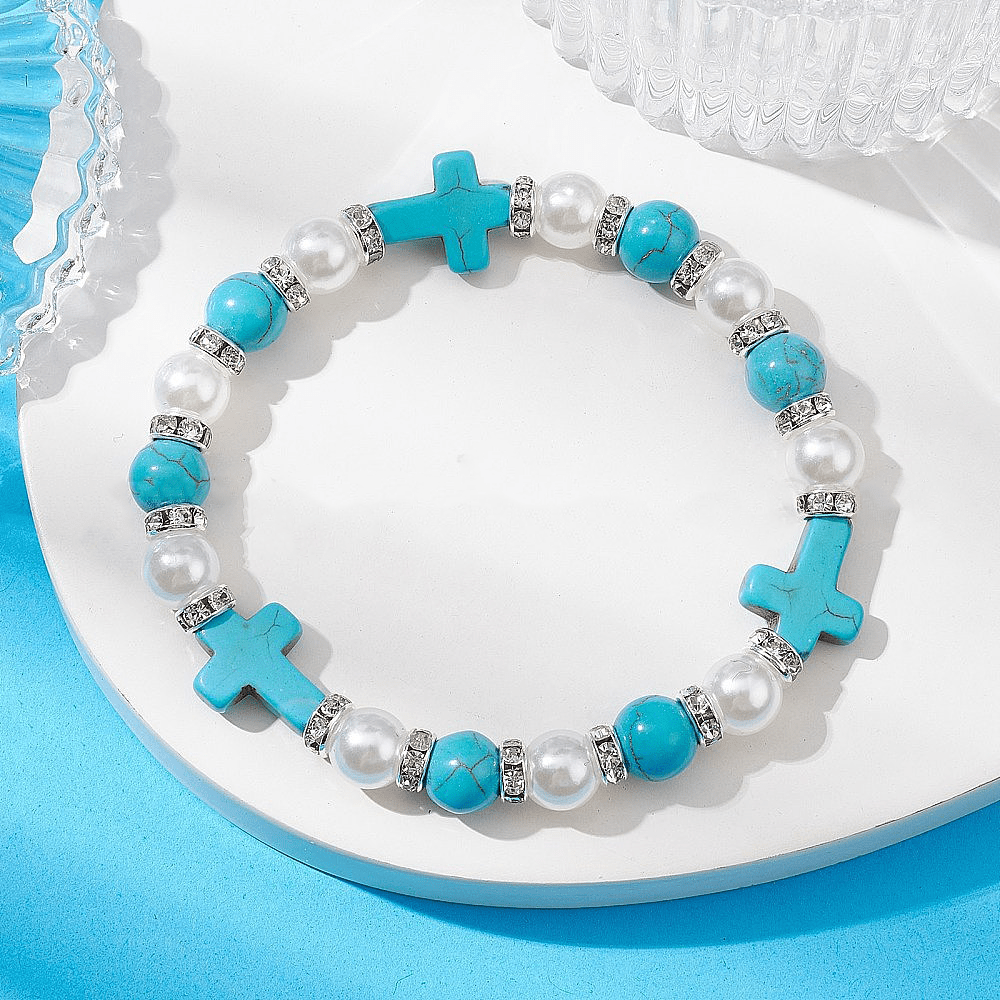 Christianartworkshop Armband mit heilender Energie und Perlen und türkisfarbenem Kreuz - Kreuz & Perle - image 1