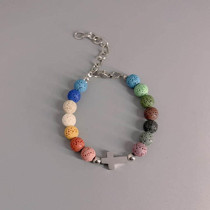Christianartworkshop Minimalistisches Armband aus farbigen Vulkansteinperlen mit Kreuzmotiv - image 4