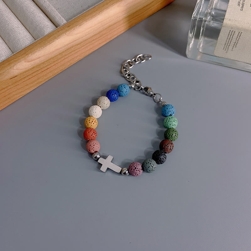 Christianartworkshop Minimalistisches Armband aus farbigen Vulkansteinperlen mit Kreuzmotiv - image 3