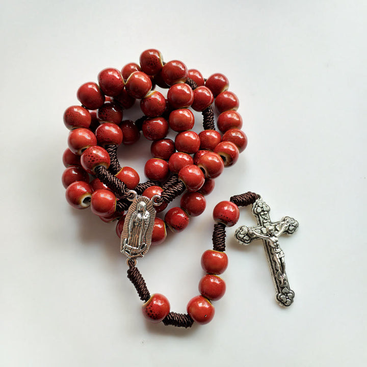 Christianartworkshop Rosenkranz „Unsere Liebe Frau von Guadalupe“ mit Kruzifix, rund, 10 mm, rote Keramik-Nylonschnur