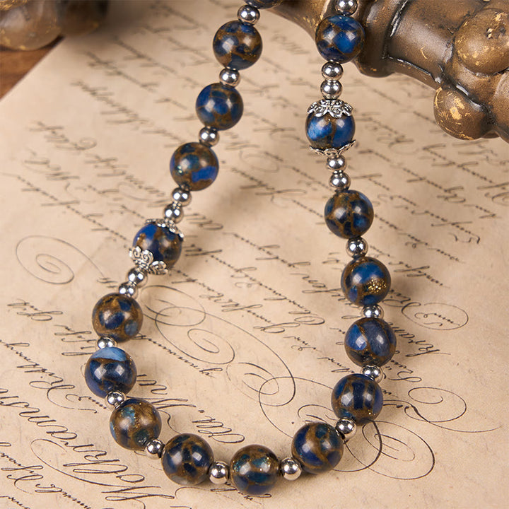 Christianartworkshop Rosenkranz mit Jungfrau Maria und blauem Kruzifix aus 8 mm blauen und goldenen Steinperlen
