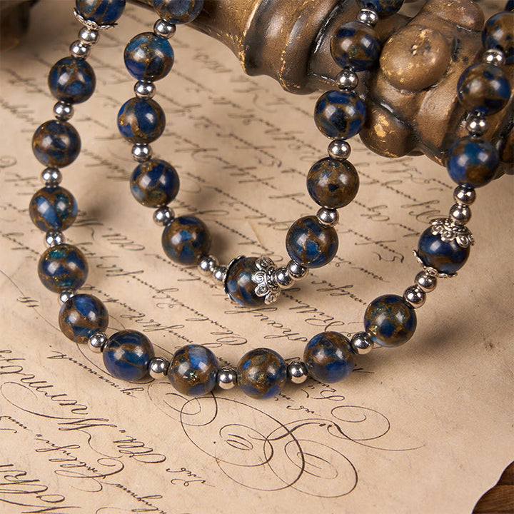Christianartworkshop Rosenkranz mit Jungfrau Maria und blauem Kruzifix aus 8 mm blauen und goldenen Steinperlen