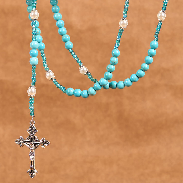 Christianartworkshop Rosenkranz mit Medaille und Kruzifix Unserer Lieben Frau aus 8 mm runden blau-türkisfarbenen Perlen