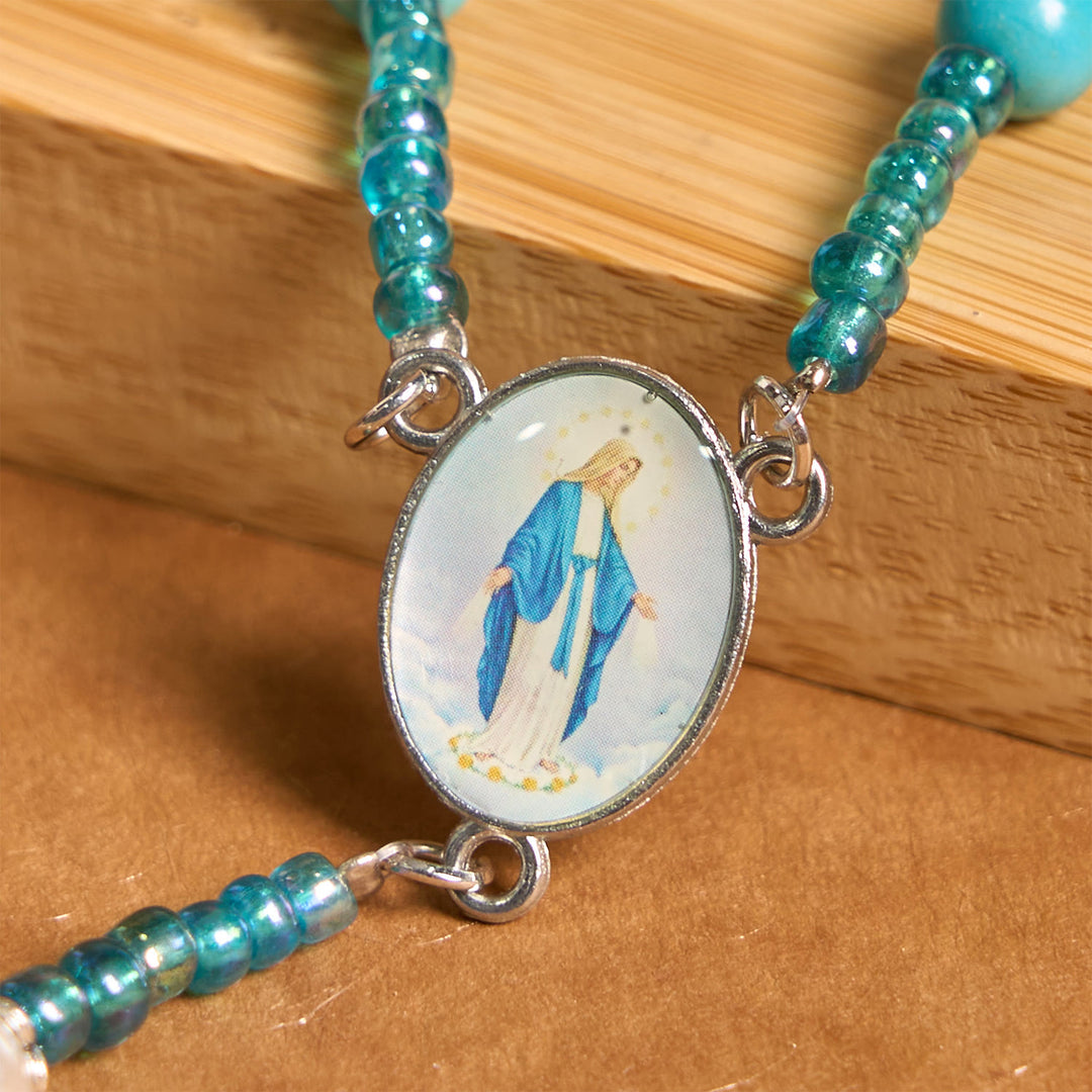 Christianartworkshop Rosenkranz mit Medaille und Kruzifix Unserer Lieben Frau aus 8 mm runden blau-türkisfarbenen Perlen