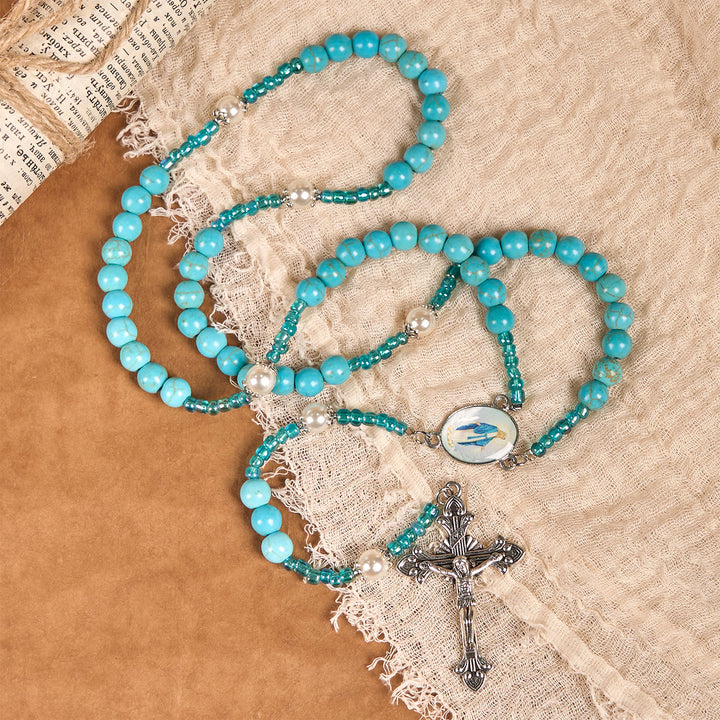 Christianartworkshop Rosenkranz mit Medaille und Kruzifix Unserer Lieben Frau aus 8 mm runden blau-türkisfarbenen Perlen