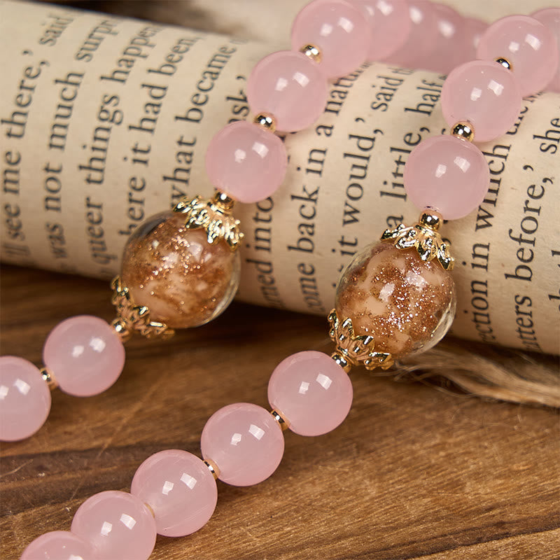 Christianartworkshop Handgefertigter Rosenkranz mit rosa Chalcedon und goldenem Porzellansand, Vaterunser-Perlen