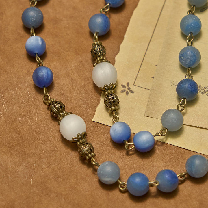 Christianartworkshop Handgefertigter Rosenkranz mit natürlichen blauen Aventurinperlen und Kruzifix – Mattblau des Friedens