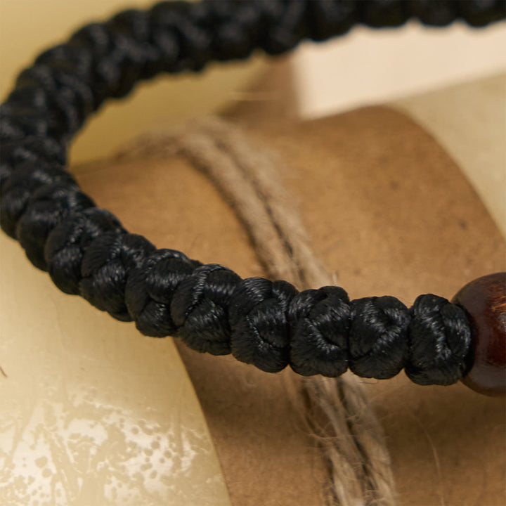 Christianartworkshop Blaues und schwarzes Kreuz – Knotenarmband: Ein Zeichen des Glaubens