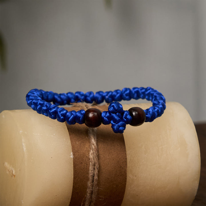 Christianartworkshop Blaues und schwarzes Kreuz – Knotenarmband: Ein Zeichen des Glaubens