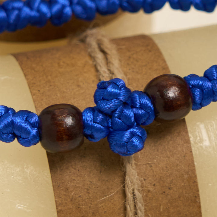 Christianartworkshop Blaues und schwarzes Kreuz – Knotenarmband: Ein Zeichen des Glaubens