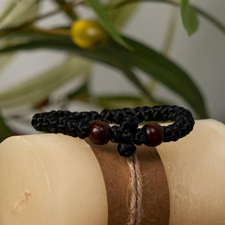 Christianartworkshop Blaues und schwarzes Kreuz – Knotenarmband: Ein Zeichen des Glaubens