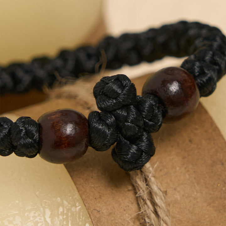 Christianartworkshop Blaues und schwarzes Kreuz – Knotenarmband: Ein Zeichen des Glaubens