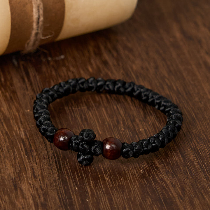 Christianartworkshop Blaues und schwarzes Kreuz – Knotenarmband: Ein Zeichen des Glaubens
