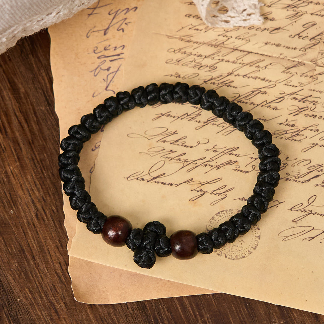 Christianartworkshop Blaues und schwarzes Kreuz – Knotenarmband: Ein Zeichen des Glaubens