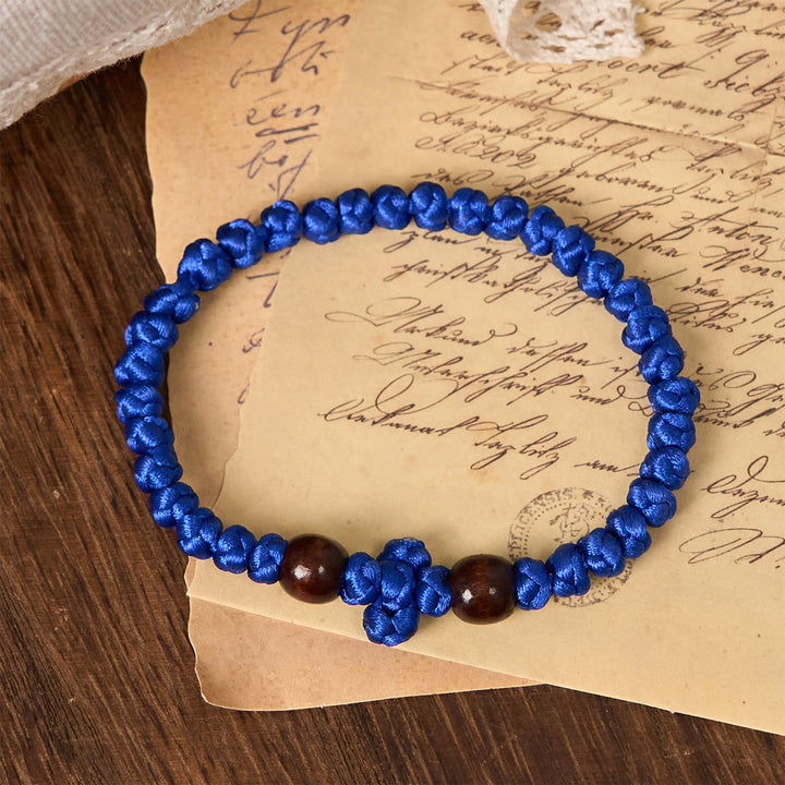 Christianartworkshop Blaues und schwarzes Kreuz – Knotenarmband: Ein Zeichen des Glaubens