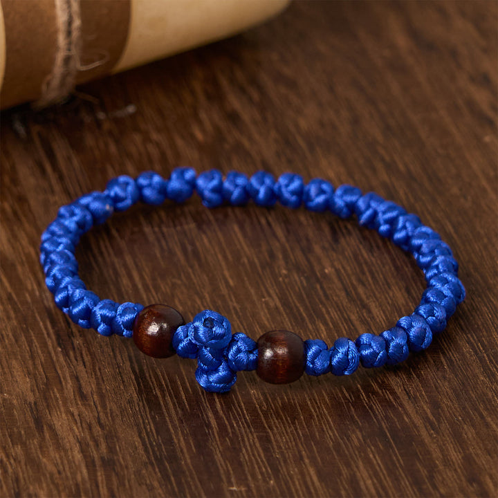 Christianartworkshop Blaues und schwarzes Kreuz – Knotenarmband: Ein Zeichen des Glaubens