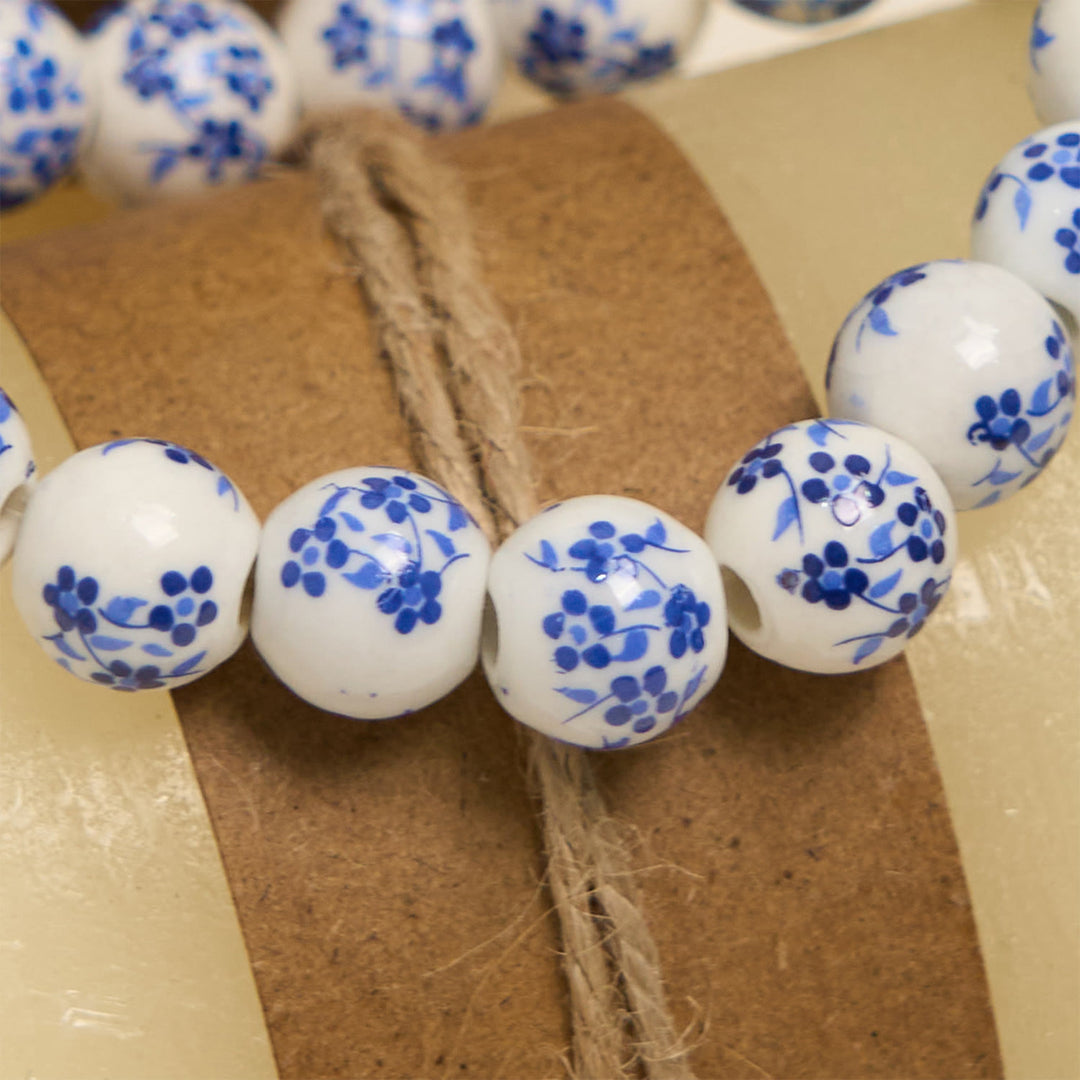 Christianartworkshop Armband mit Blumenmuster und Perlen in Blau und Weiß mit Wundertätiger Medaille