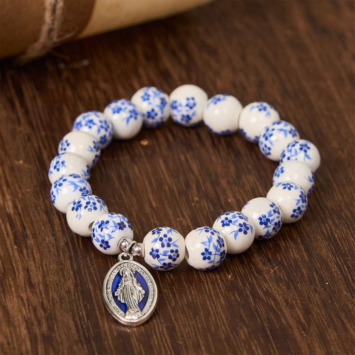 Christianartworkshop Armband mit Blumenmuster und Perlen in Blau und Weiß mit Wundertätiger Medaille