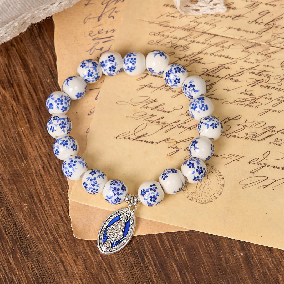 Christianartworkshop Armband mit Blumenmuster und Perlen in Blau und Weiß mit Wundertätiger Medaille
