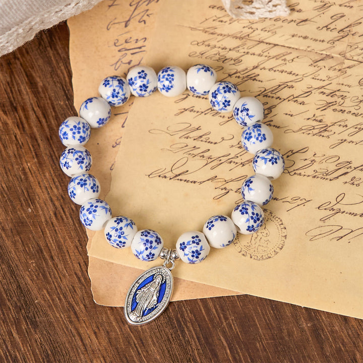 Christianartworkshop Armband mit Blumenmuster und Perlen in Blau und Weiß mit Wundertätiger Medaille