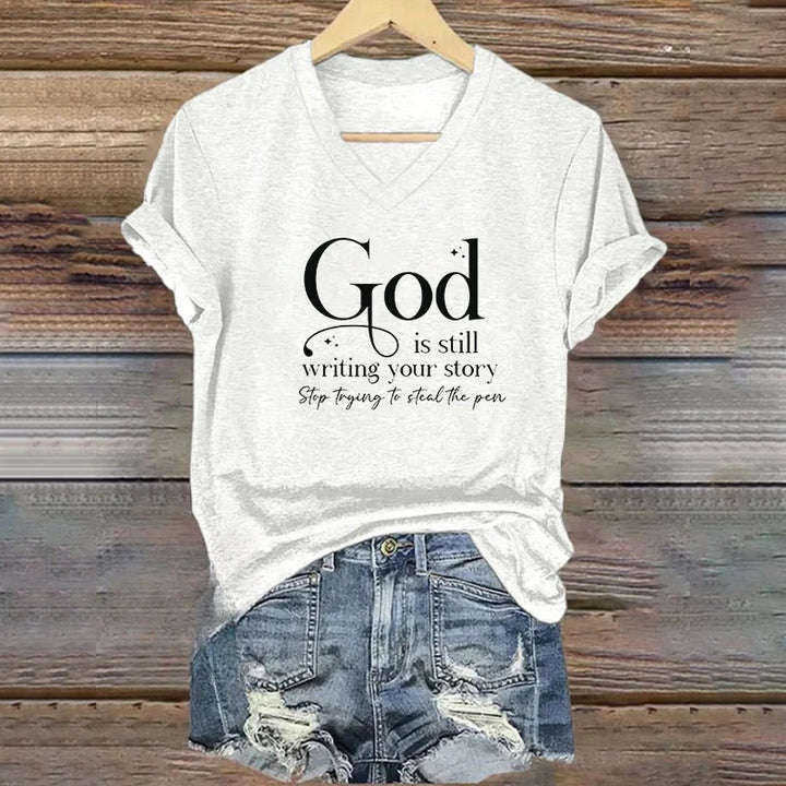 Christianartworkshop Damen T-Shirt mit V-Ausschnitt und Aufdruck „God Is Still Writing Your Story“