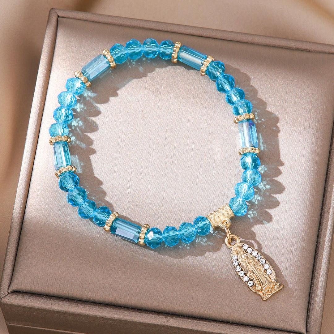 Romantisches, mehrfarbiges Armband aus klarem Kristall von Christianartworkshop mit goldener und diamantbesetzter Wundermedaille - Lake Blue - image 1