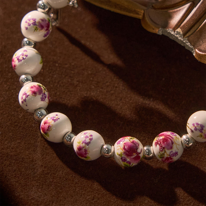 Christianartworkshop Mehrfarbiges florales Keramik-Stretcharmband mit Wundertätiger Medaille und Kruzifix: Dezente Eleganz des Glaubens - image 17