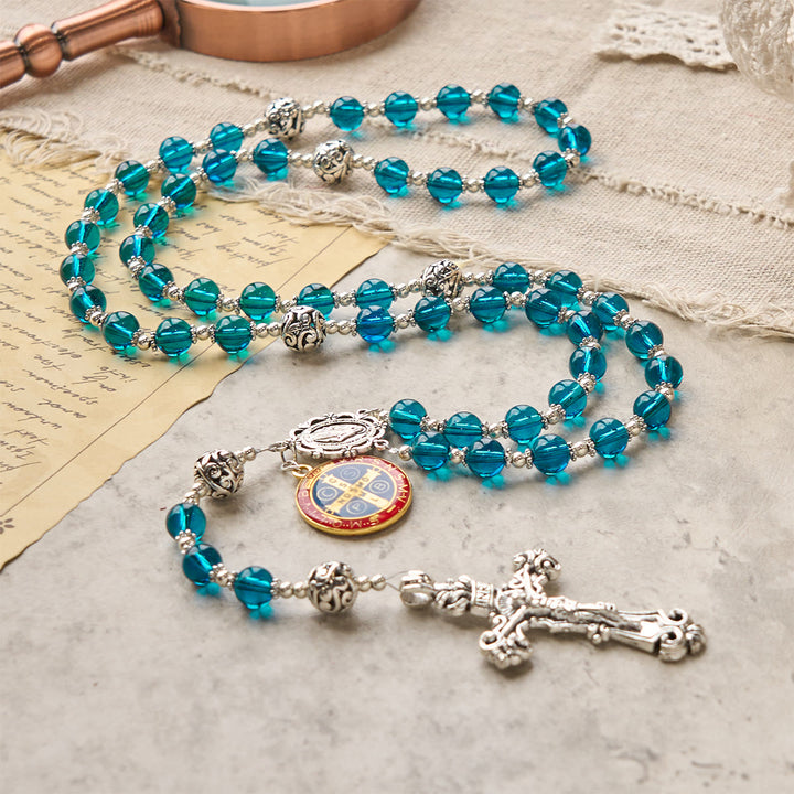 Christianartworkshop Handgefertigter Rosenkranz aus klarem, blauem Glas mit Kruzifix, emaillierter St.-Benedikt-Figur und Wundermedaille - image 0