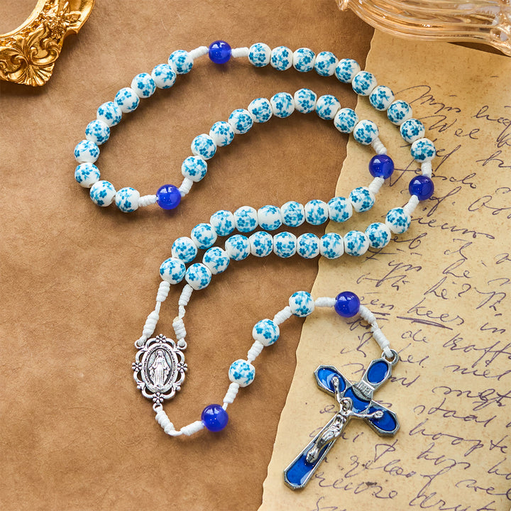 Christianartworkshop Rosenkranz mit Perlen und blauem Blütenmuster, mit Wundertätiger Medaille und Kruzifix