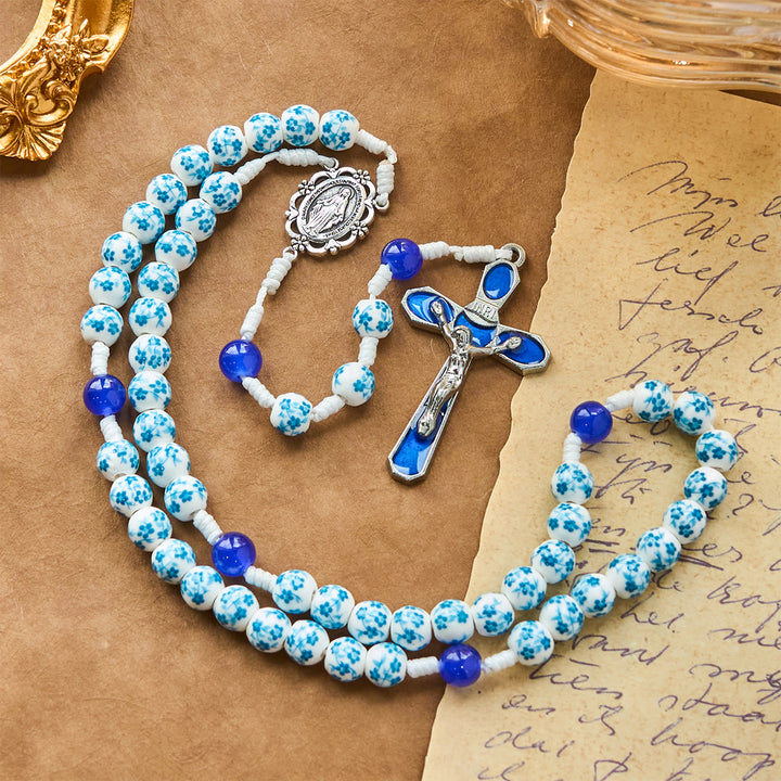 Christianartworkshop Rosenkranz mit Perlen und blauem Blütenmuster, mit Wundertätiger Medaille und Kruzifix