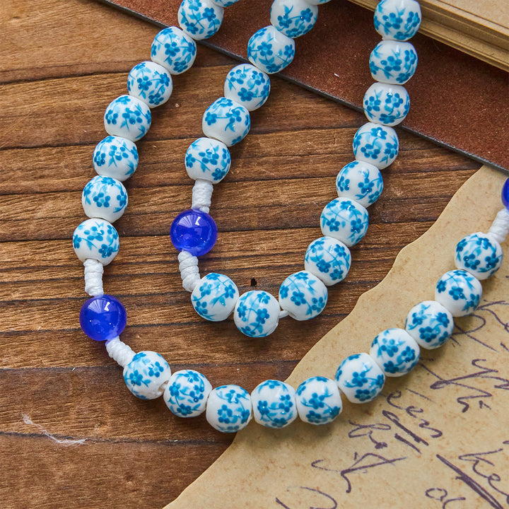 Christianartworkshop Rosenkranz mit Perlen und blauem Blütenmuster, mit Wundertätiger Medaille und Kruzifix