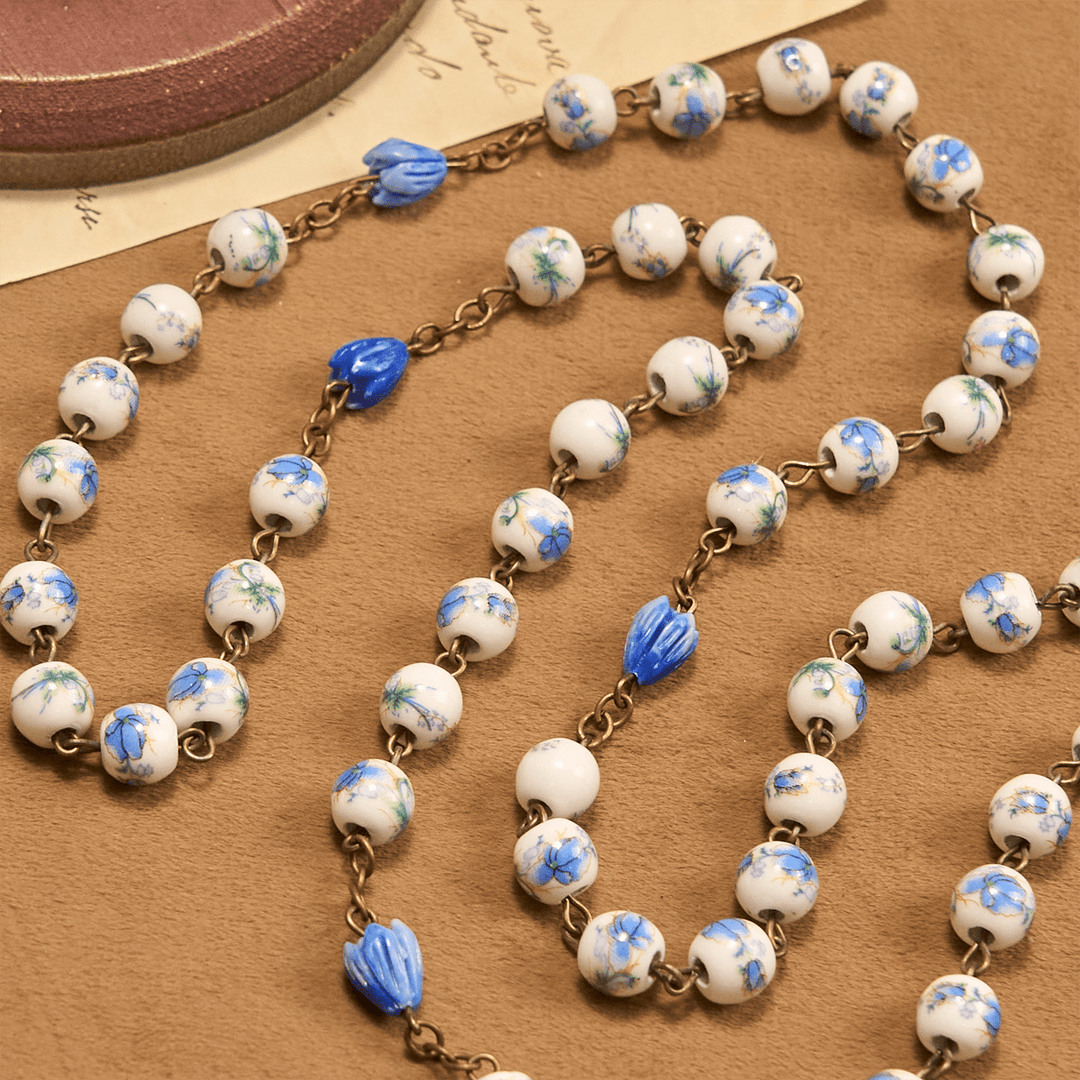 Christianartworkshop Rosenkranz mit unbeflecktem Herzen Mariens und Kruzifix, rund, 8 mm, blaue Kette aus Acryllegierung mit Blumenmuster - image 7