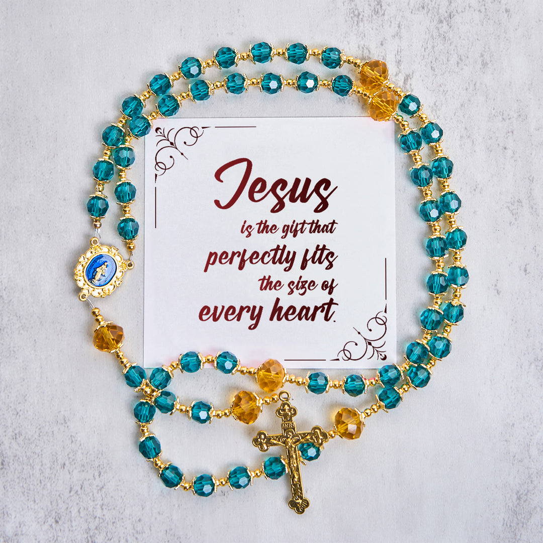Christianartworkshop Jesus ist das Geschenk: Handgefertigter Rosenkranz aus pfauenblauen Kristallperlen mit Geschenkkarte - Jesus ist das Geschenk - image 1