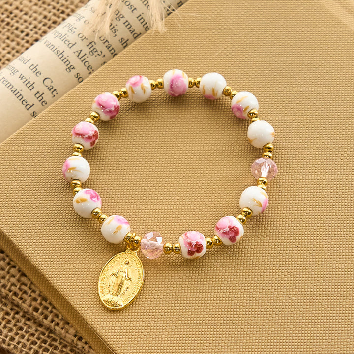 Christianartworkshop Elegantes 8 mm großes Armband aus rosa Keramik mit Blumenmuster und Wundertätiger Medaille - image 3