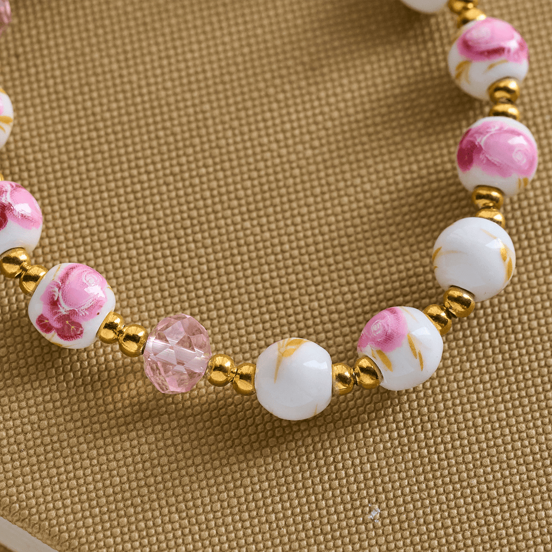 Christianartworkshop Elegantes 8 mm großes Armband aus rosa Keramik mit Blumenmuster und Wundertätiger Medaille - image 5