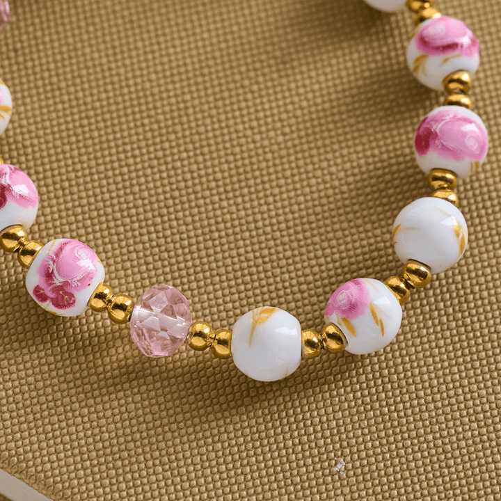 Christianartworkshop Elegantes 8 mm großes Armband aus rosa Keramik mit Blumenmuster und Wundertätiger Medaille - image 5