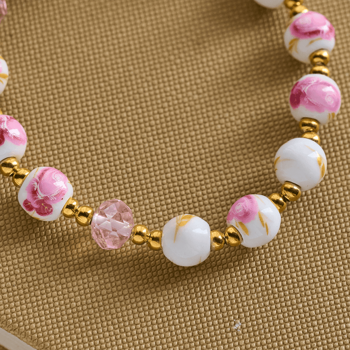 Christianartworkshop Elegantes 8 mm großes Armband aus rosa Keramik mit Blumenmuster und Wundertätiger Medaille - image 4