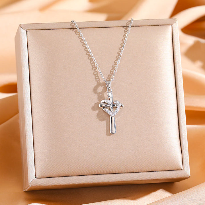 Christianartworkshop Zweifarbige Herz- und Kreuzkette mit Zirkonen: Verschmelzung von Liebe und Glauben - Silbernes Kreuz mit silbernem Herz - image 2