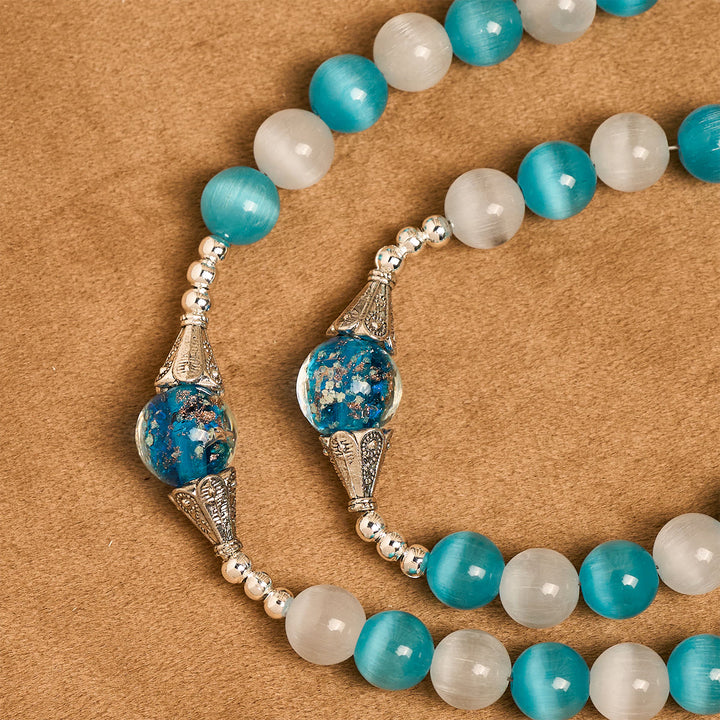 Christianartworkshop Glitzernder Rosenkranz aus Katzenaugenstein und blauem Sternglas mit Heiligem Herzen - image 5