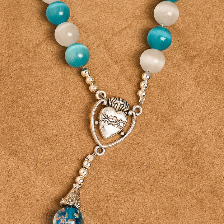 Christianartworkshop Glitzernder Rosenkranz aus Katzenaugenstein und blauem Sternglas mit Heiligem Herzen - image 6