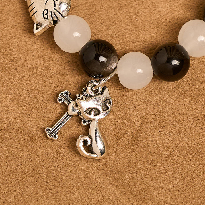 Christianartworkshop Segen Unserer Lieben Frau mit schwarz-weißen Kuh- und Katzenperlen, Tierarmband - image 6