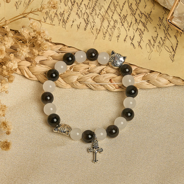 Christianartworkshop Segen Unserer Lieben Frau mit schwarz-weißen Kuh- und Katzenperlen, Tierarmband - image 2