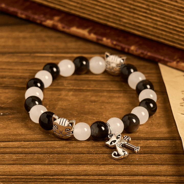 Christianartworkshop Segen Unserer Lieben Frau mit schwarz-weißen Kuh- und Katzenperlen, Tierarmband - image 5
