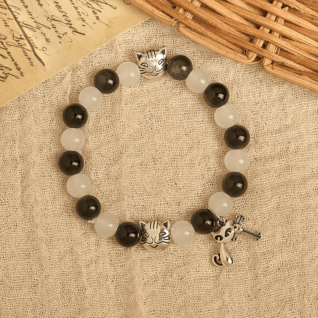 Christianartworkshop Segen Unserer Lieben Frau mit schwarz-weißen Kuh- und Katzenperlen, Tierarmband - image 3