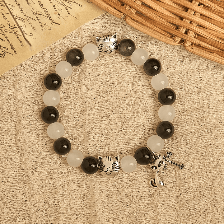 Christianartworkshop Segen Unserer Lieben Frau mit schwarz-weißen Kuh- und Katzenperlen, Tierarmband - image 3