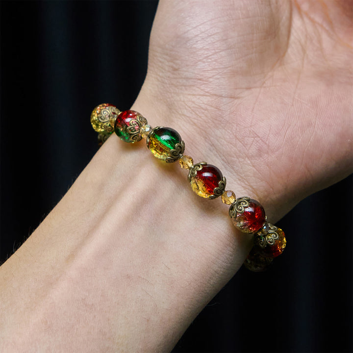 Christianartworkshop Weihnachtsschmuck-Armband aus rot-grün-goldenen Glasperlen: Glaube, der leuchtet - image 2