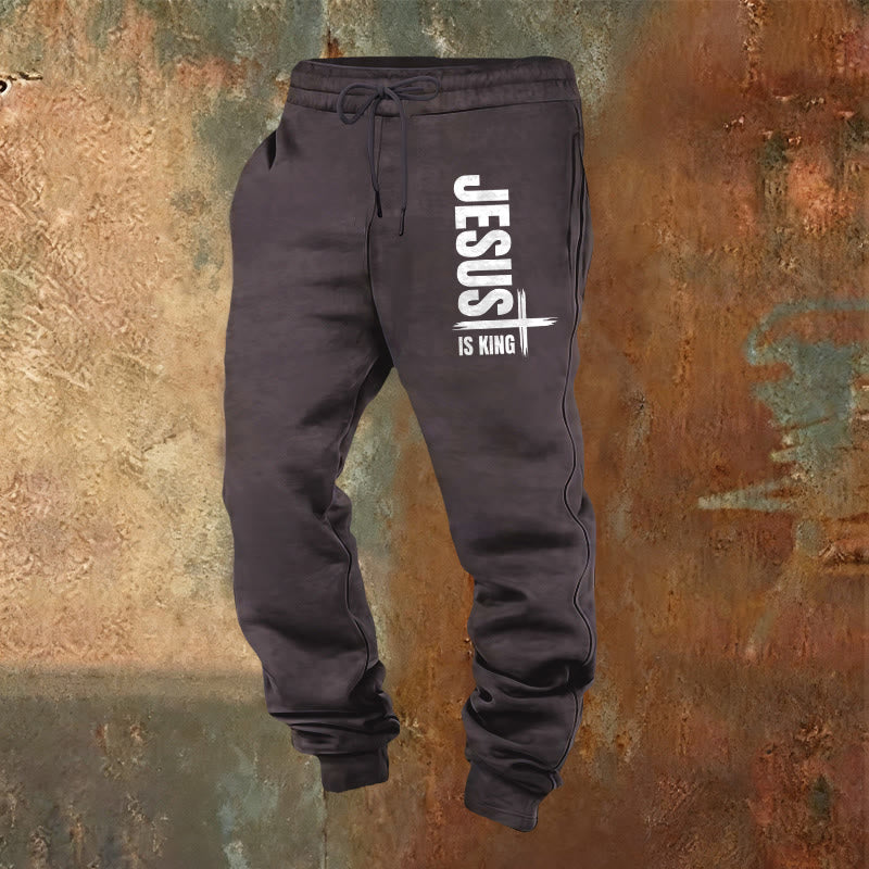 Christianartworkshop Jesus Is King Jogginghose: Alltagskleidung mit königlichem Glauben - Dunkelgrau - 2XL - image 0