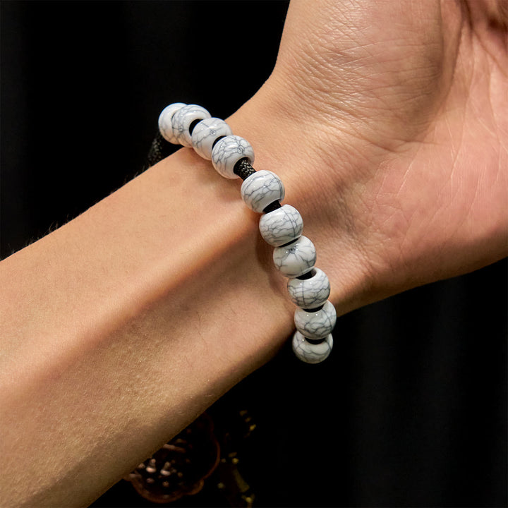 Christianartworkshop Rosenkranz im Taschenformat mit mattweißen Crackle-Perlen und heiligem Kreuz aus Messing - image 1