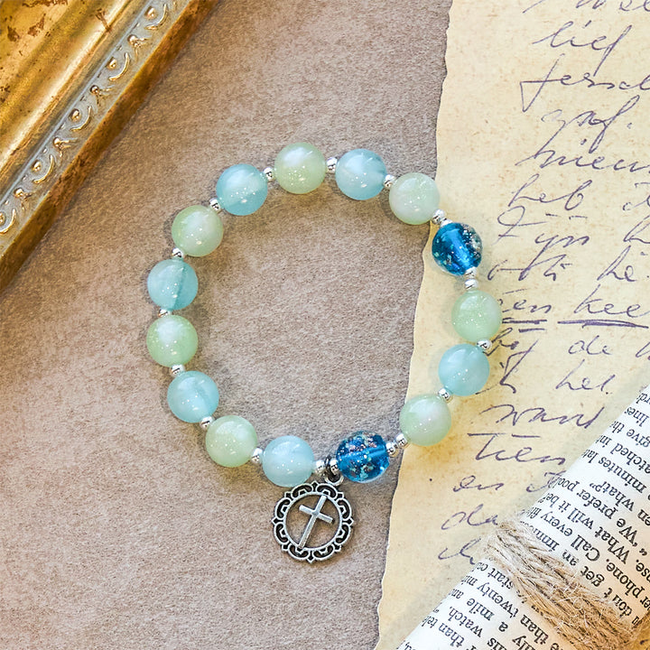 Christianartworkshop UV-wechselndes Glitzerperlenarmband mit verziertem Kreuz: Schimmert in leuchtenden Farben - image 5