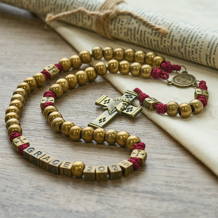 Christianartworkshop Rosenkranz „Grace & Year Bronze Red St. Benedikt“: Gedenkperlen 2026 mit individuellen Initialen - Rosenkranz für das neue Jahr 2026 - image 0